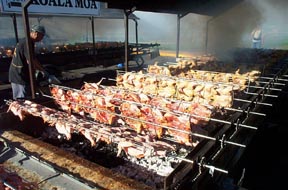 chicken cooking on the grills